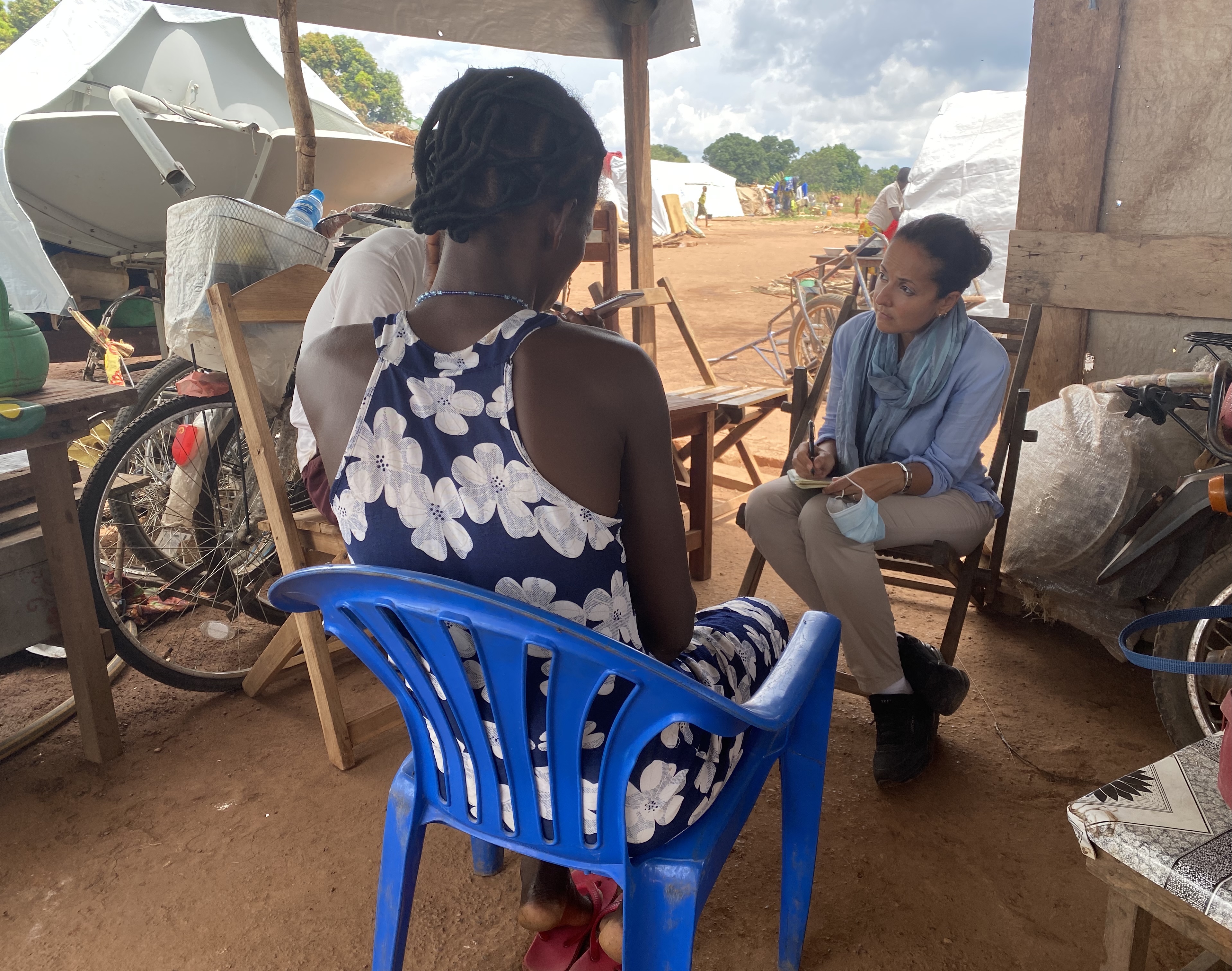 Rawya Rageh in a camp for displaced persons in Tambura, Western Equatoria State, South Sudan, 2021, interviewing a survivor who had fled fighting in her village.